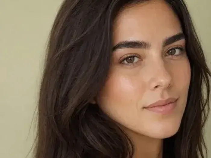 Brows brushed upward to lift the eye area