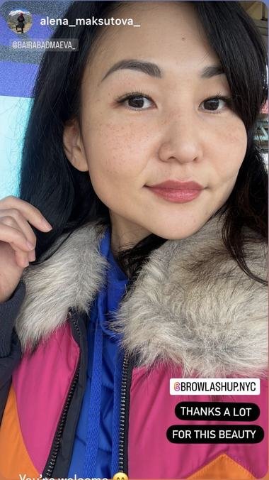 A client wearing lashes by brow and lash up