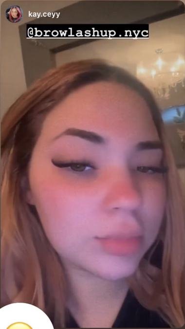 A client wearing lashes by brow and lash up