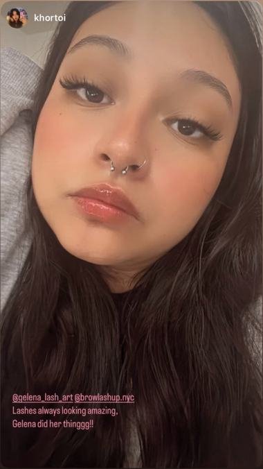 A client wearing lashes by brow and lash up